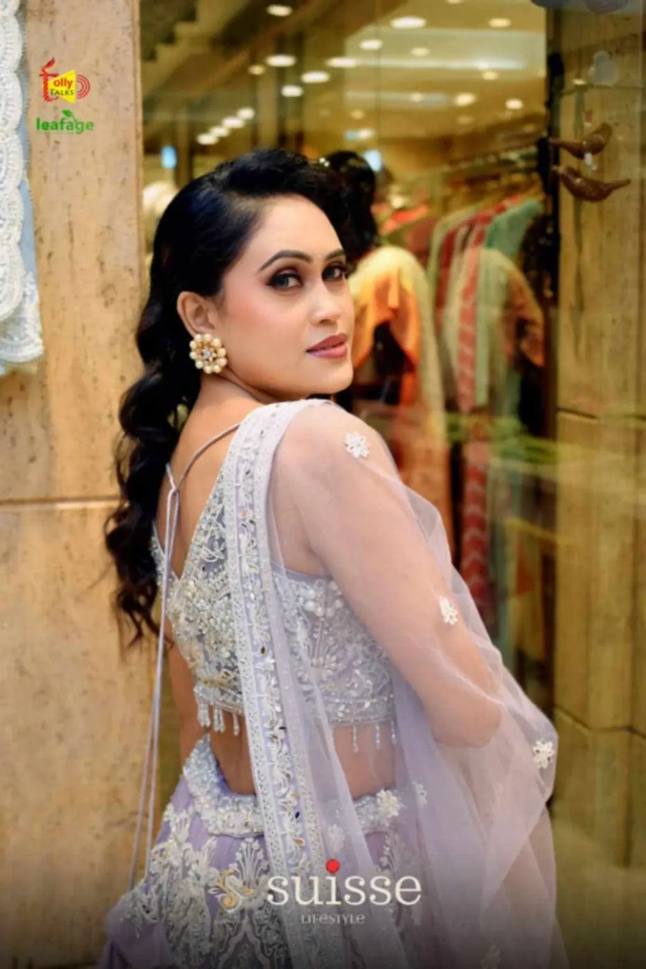 Over-the-shoulder boutique ethnic fashion pose