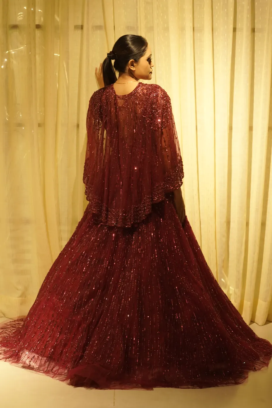 Back view of couture red gown styling